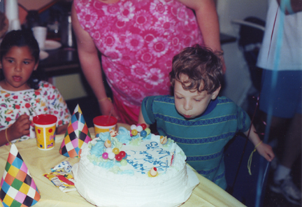 Louis blowing out candles