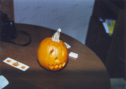 Pumpkin w lit candle inside
